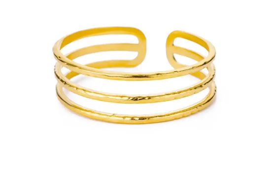 BRAZALETE FABIOLA. Brazalete rígido ajustable de acero inoxidable bañado en oro de 18k