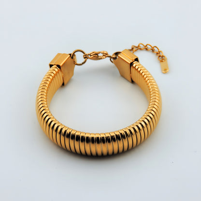 PULSERA CALA. Pulsera ajustable elástica de acero inoxidable bañado en oro