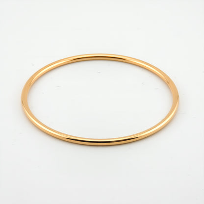 PULSERA CARMEN. Pulsera rígida de acero inoxidable bañado en oro