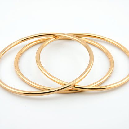 PULSERA CARMEN. Pulsera rígida de acero inoxidable bañado en oro