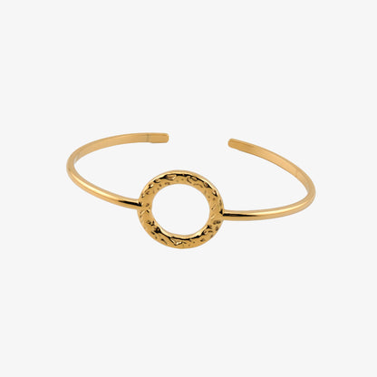 BRAZALETE MACARENA. Brazalete rígido ajustable de acero inoxidable bañado en oro de 18k
