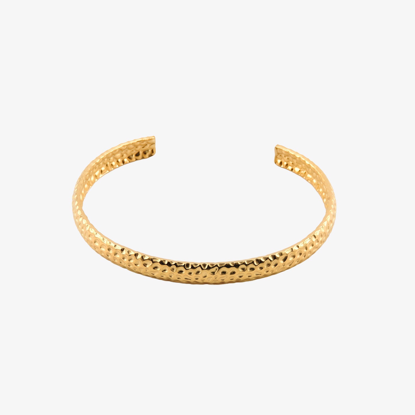 BRAZALETE NINES. Brazalete rígido ajustable de acero inoxidable bañado en oro de 18k