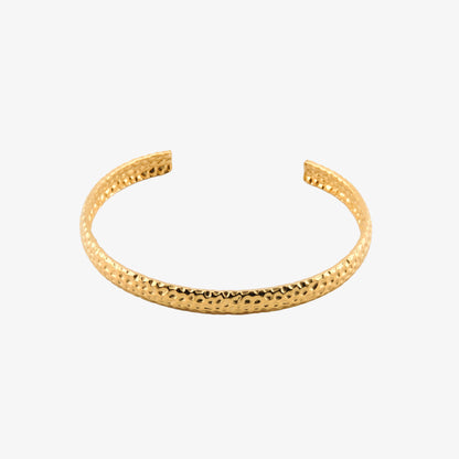 BRAZALETE NINES. Brazalete rígido ajustable de acero inoxidable bañado en oro de 18k
