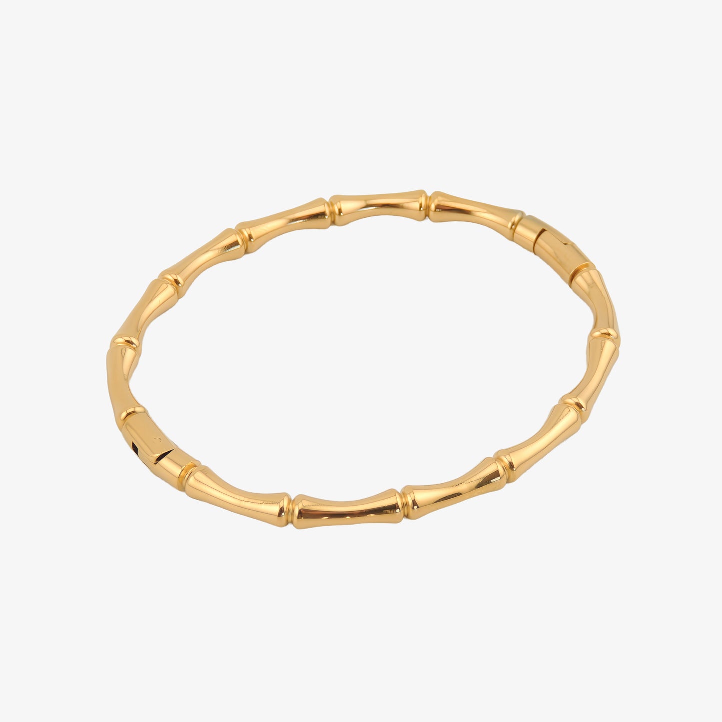 BRAZALETE VALLE. Brazalete rígido de acero inoxidable bañado en oro