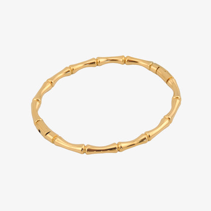 BRAZALETE VALLE. Brazalete rígido de acero inoxidable bañado en oro