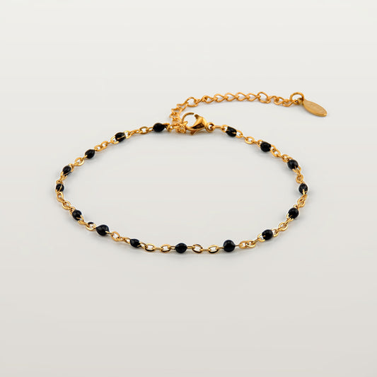 Pulsera ajustable de acero inoxidable con cuentas negras y cierre extensible de cadena