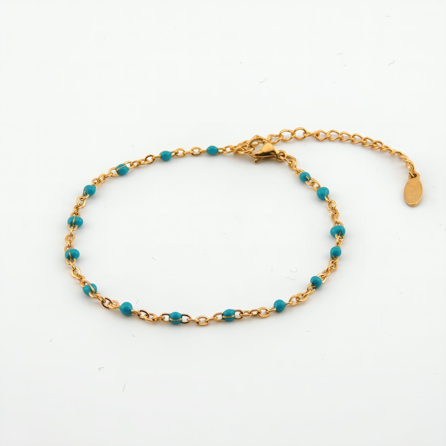 PULSERA ANGELA. Pulsera ajustable de acero inoxidable con cuentas de color azul