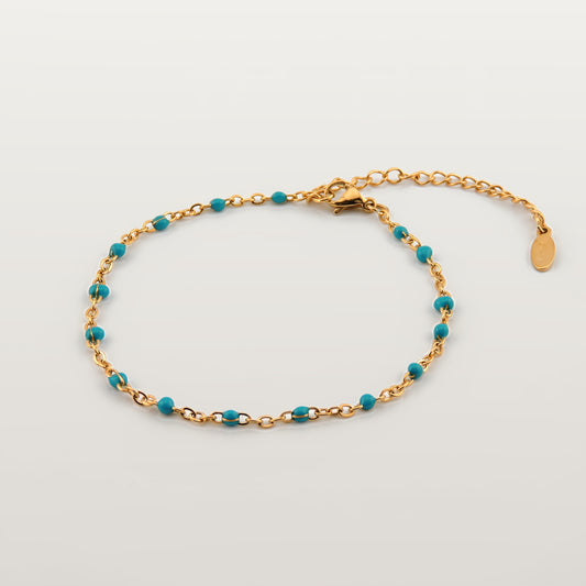 Pulsera ajustable de acero inoxidable con cuentas azul turquesa y cierre extensible