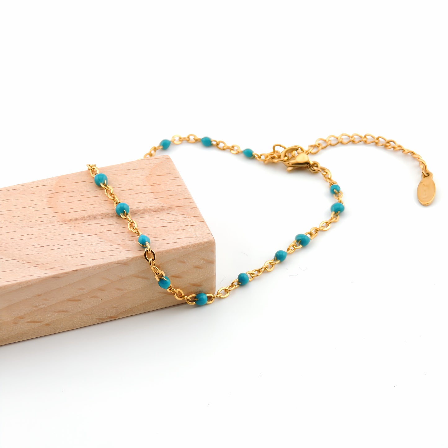 PULSERA ANGELA. Pulsera ajustable de acero inoxidable con cuentas de color azul