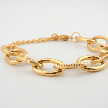 PULSERA BRISA. Pulsera ajustable de acero inoxidable bañado en oro de 18k