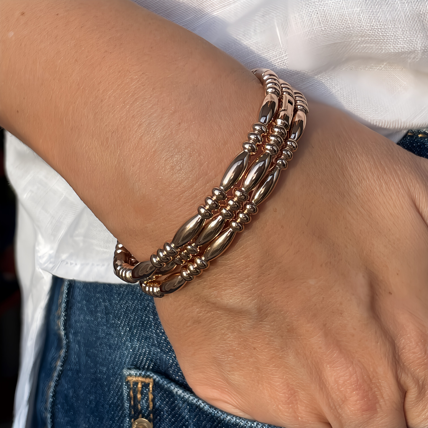 BRAZALETE ALMA. Pulsera brazalete rígido de acero inoxidable bañado en oro rosa