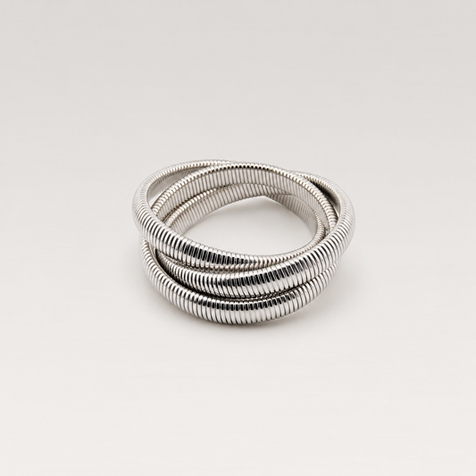 Pulsera triple elástica de acero inoxidable plateado con tres espirales entrelazadas